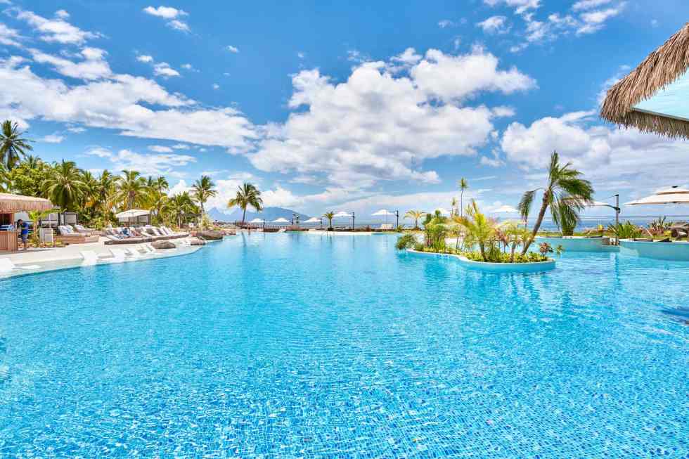  This Model-new Tahiti Resort Has the Island's Largest Pool — With a Swim-up Bar, Cabanas, and Unbelievable Sundown Views